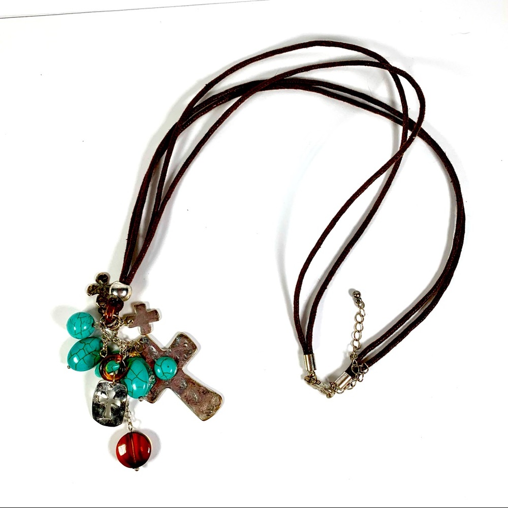 Cross necklace on brown cord